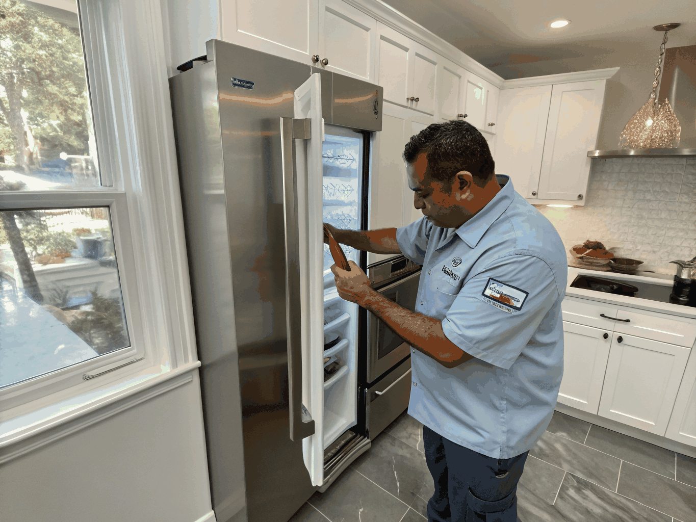 Professional technician inspecting a modern refrigerator in Clarkston, GA